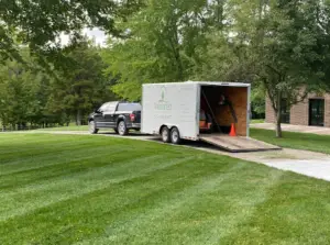 Lawn Care truck parked and being loaded with lawn mowers