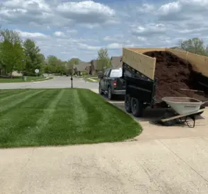 dark brown mulch about to be thrown down