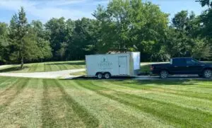 Truck parked on driveway with lawn stripes all the way around the vehicle