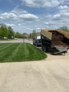 dark brown mulch about to be applied in landscape bed