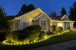 warm white holiday lights installed on customers house